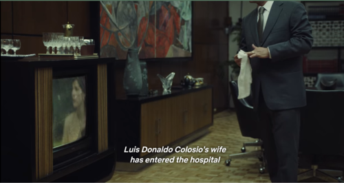 President Salinas (Ari Brickman) watches the news report the death of presidential candidate Colosio and cleans his hands. Did he have something to do with his murder? (Screenshot from Crime Diaries: The Candidate)